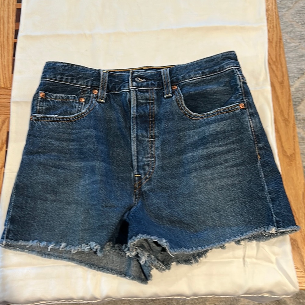 High waisted 5 buttons fringed on bottom.